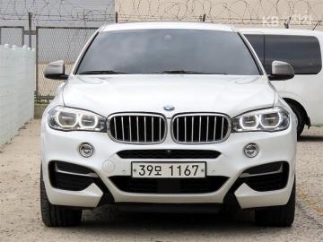 BMW X6 M50d — foto 1